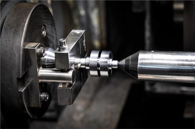 Image showing the Yoshimura camshaft or machinery relative to te text